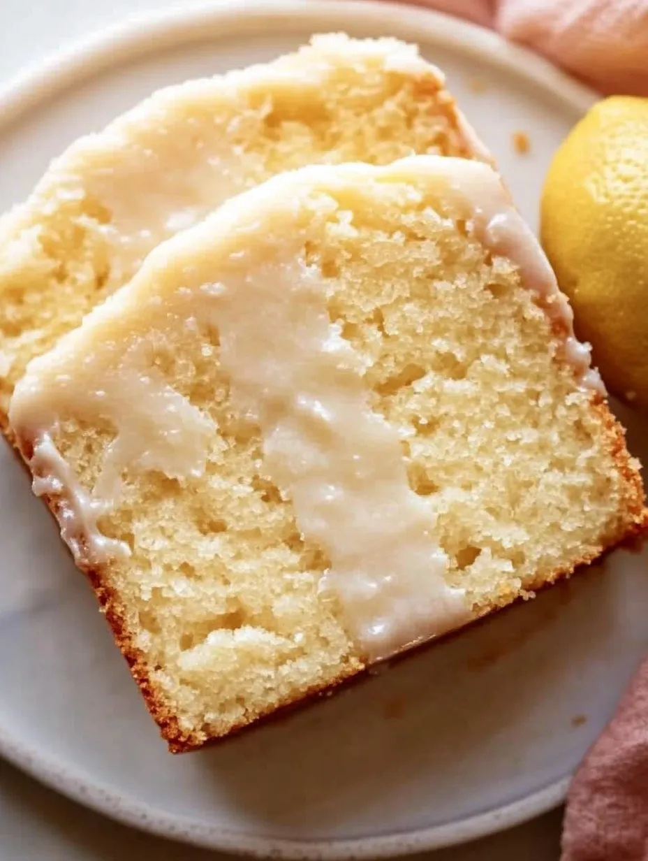 A slice of iced lemon pound cake.