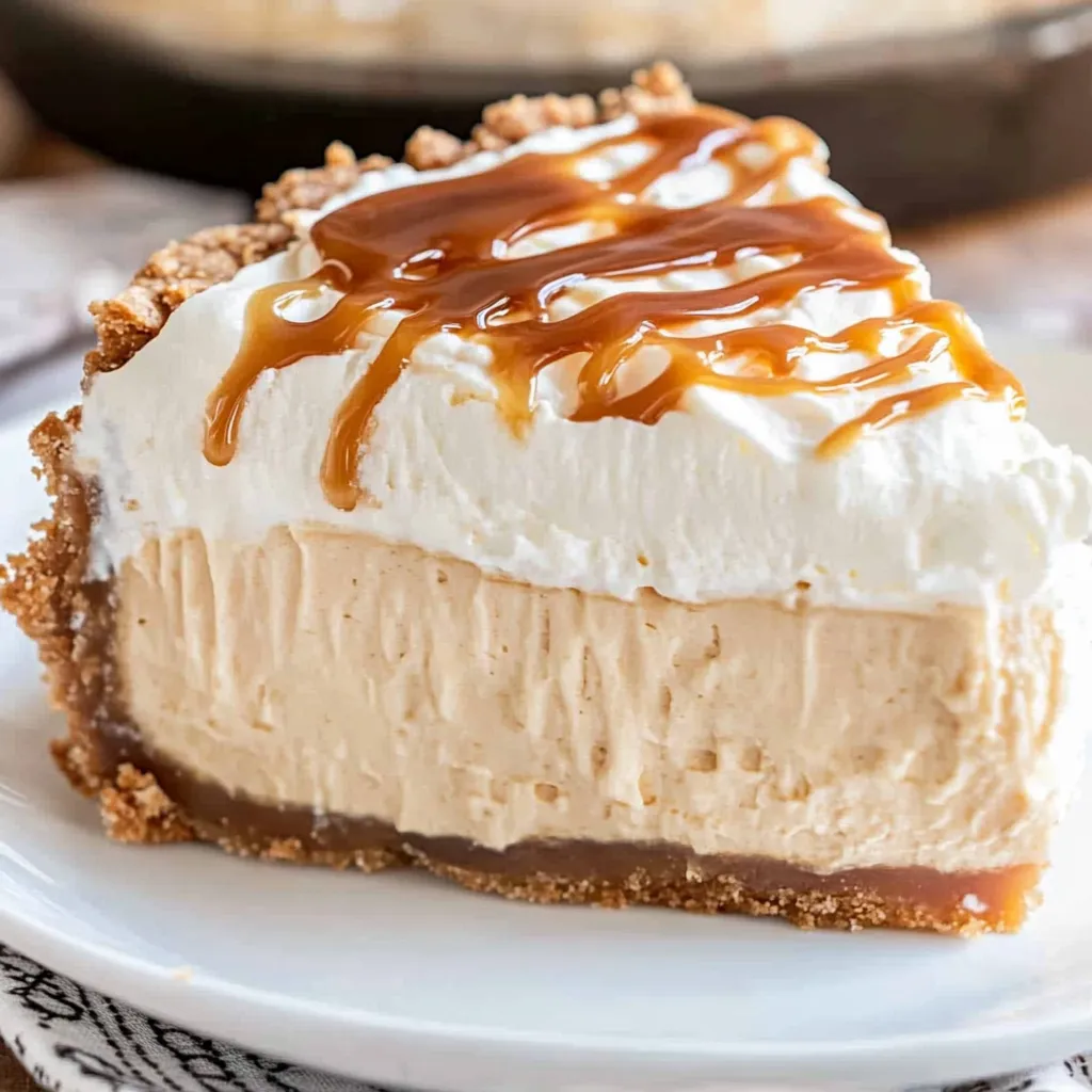 A slice of caramel cream pie on a plate.