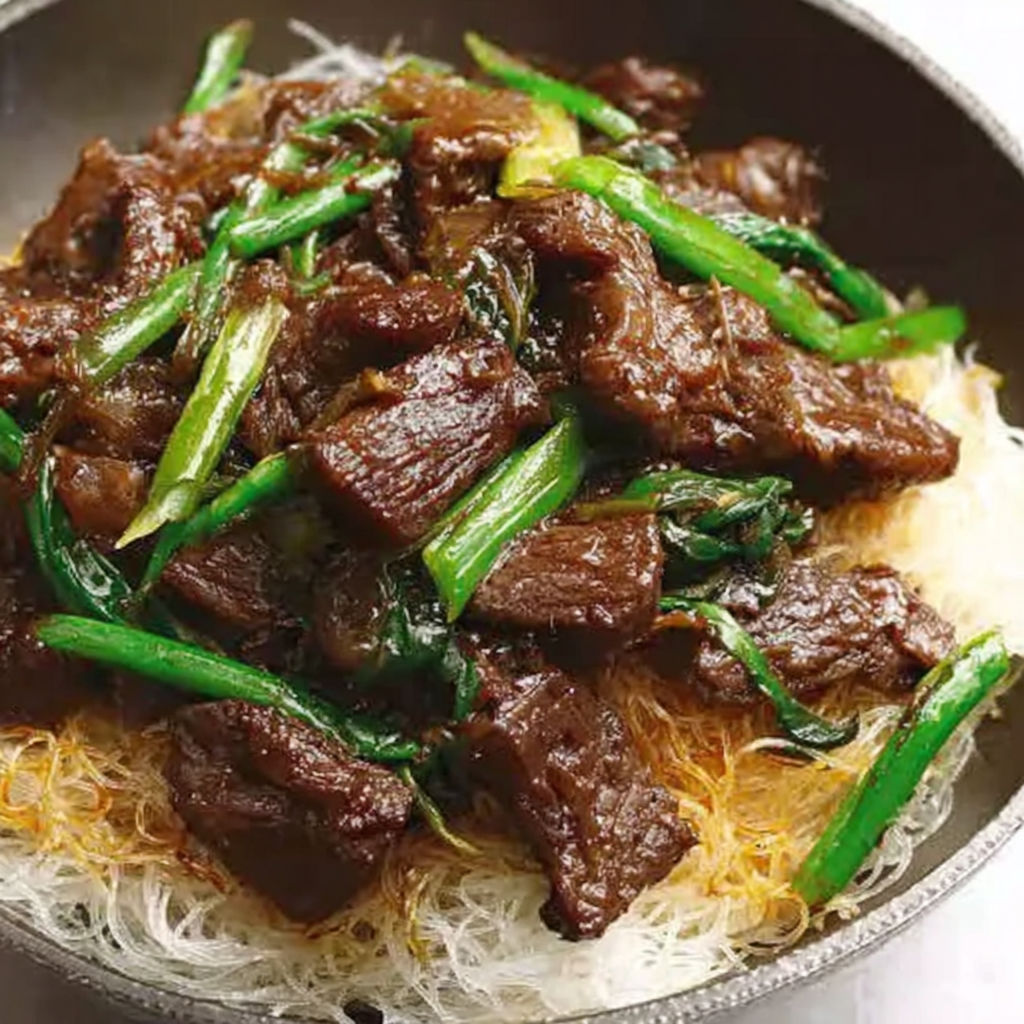 A bowl of beef and vegetables.