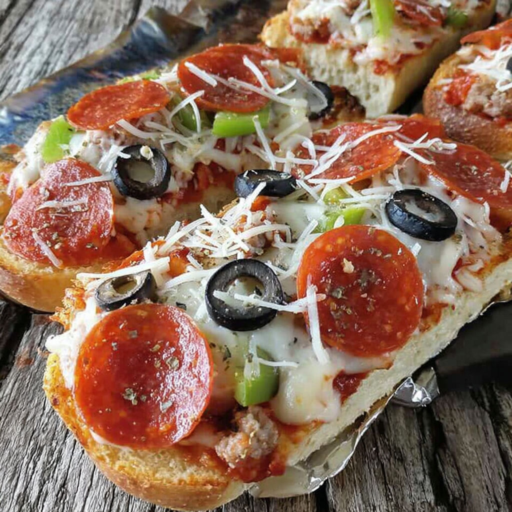 A slice of pizza with pepperoni and olives.