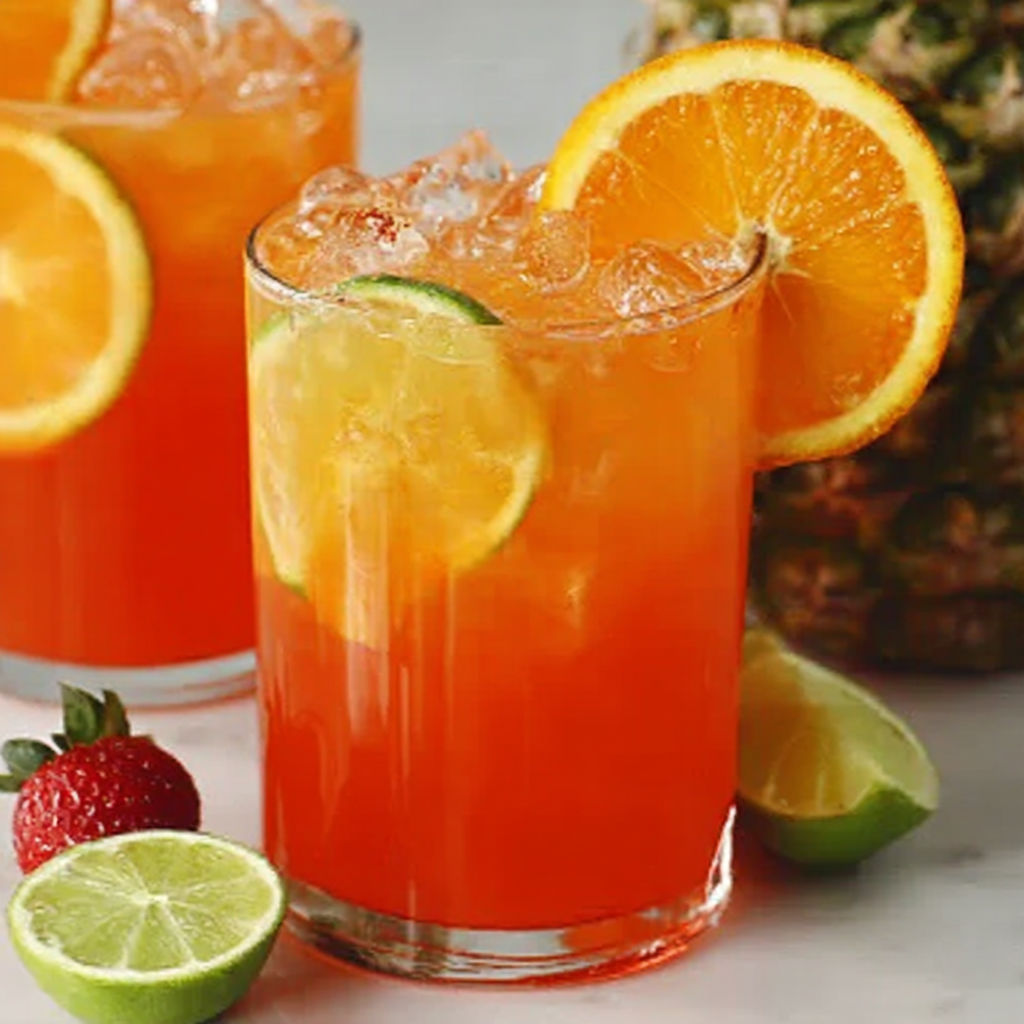 Two glasses of orange juice with slices of orange in them.