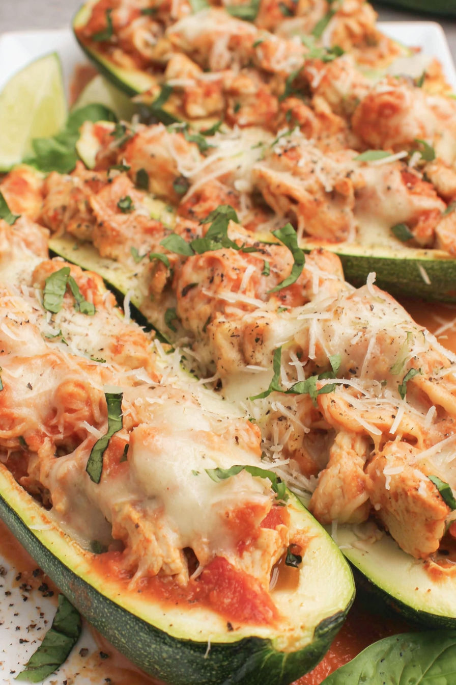 Zucchini boats with cheese and sauce.