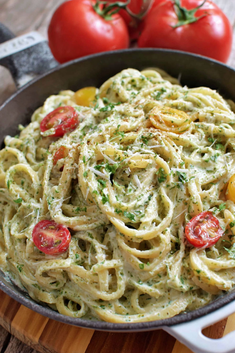 A bowl of creamy pesto pasta.