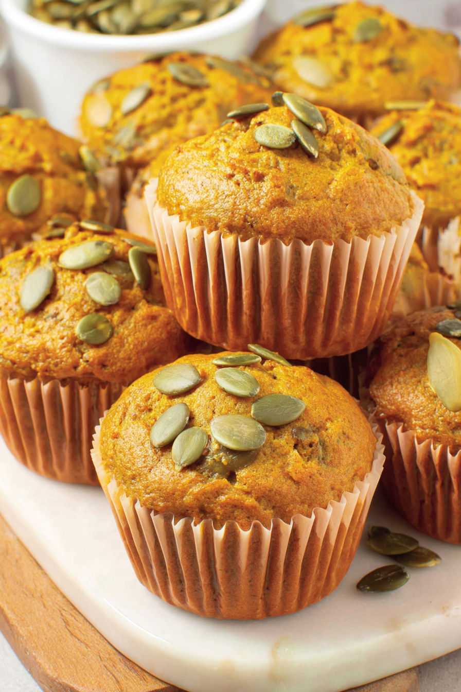 A plate of muffins with pumpkin and banana.