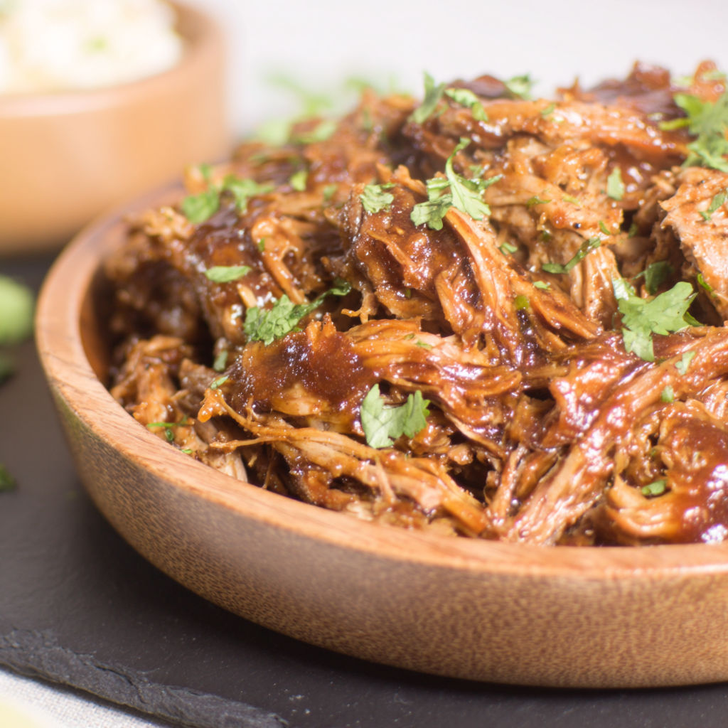 A close up of a delicious pulled pork dish.