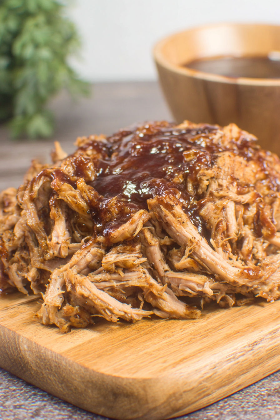 A close up of a delicious pulled pork sandwich.