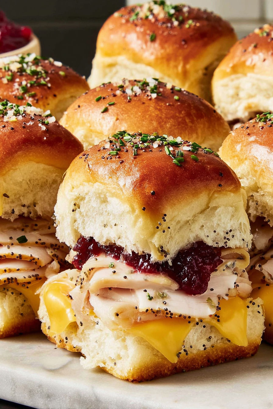 A plate of cranberry turkey sliders.