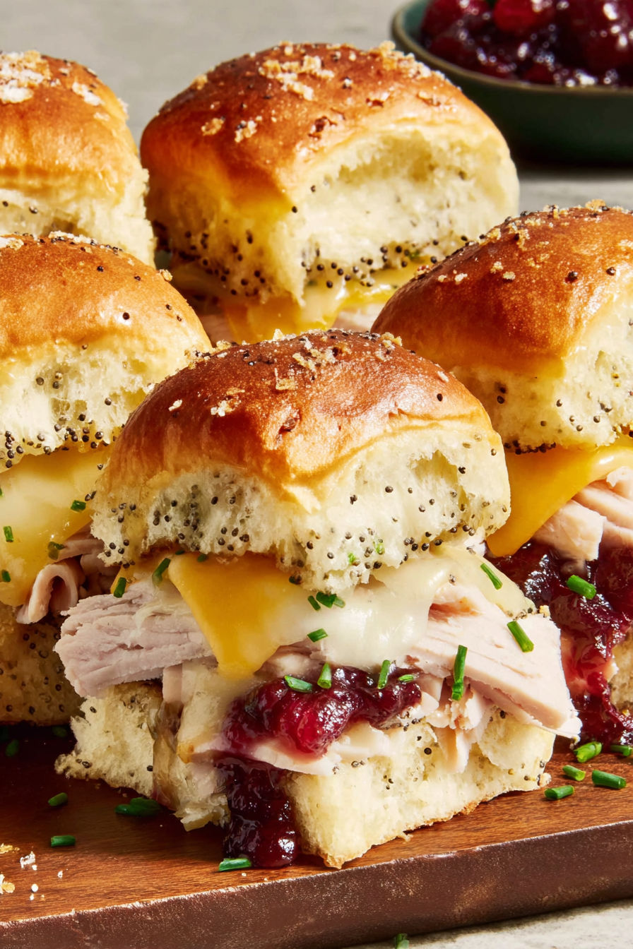 A plate of cranberry turkey sliders.