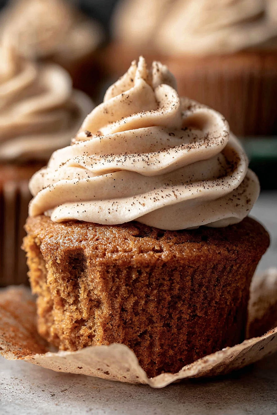 A cupcake with a pumpkin spice flavor.