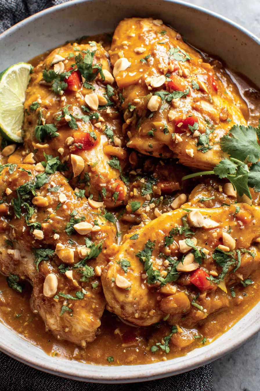 A dish of chicken with a peanut sauce.