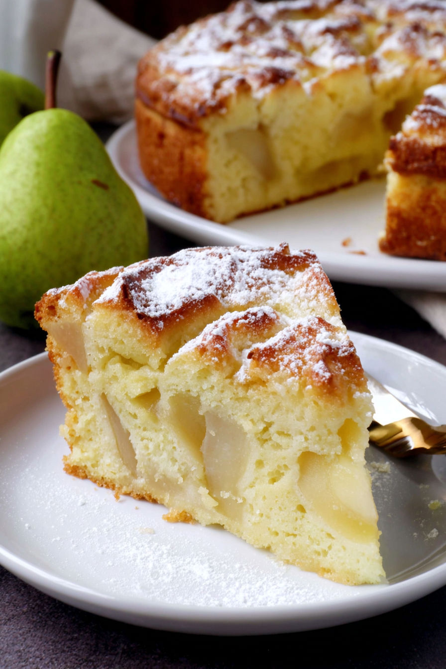 A slice of cake with powdered sugar on it.
