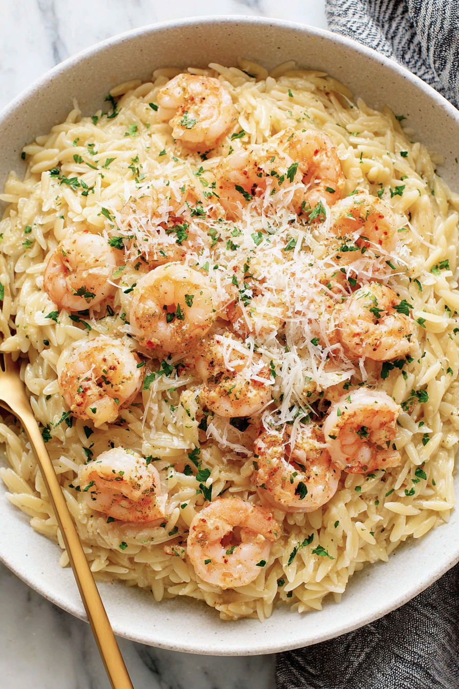 A bowl of shrimp scampi orzo.