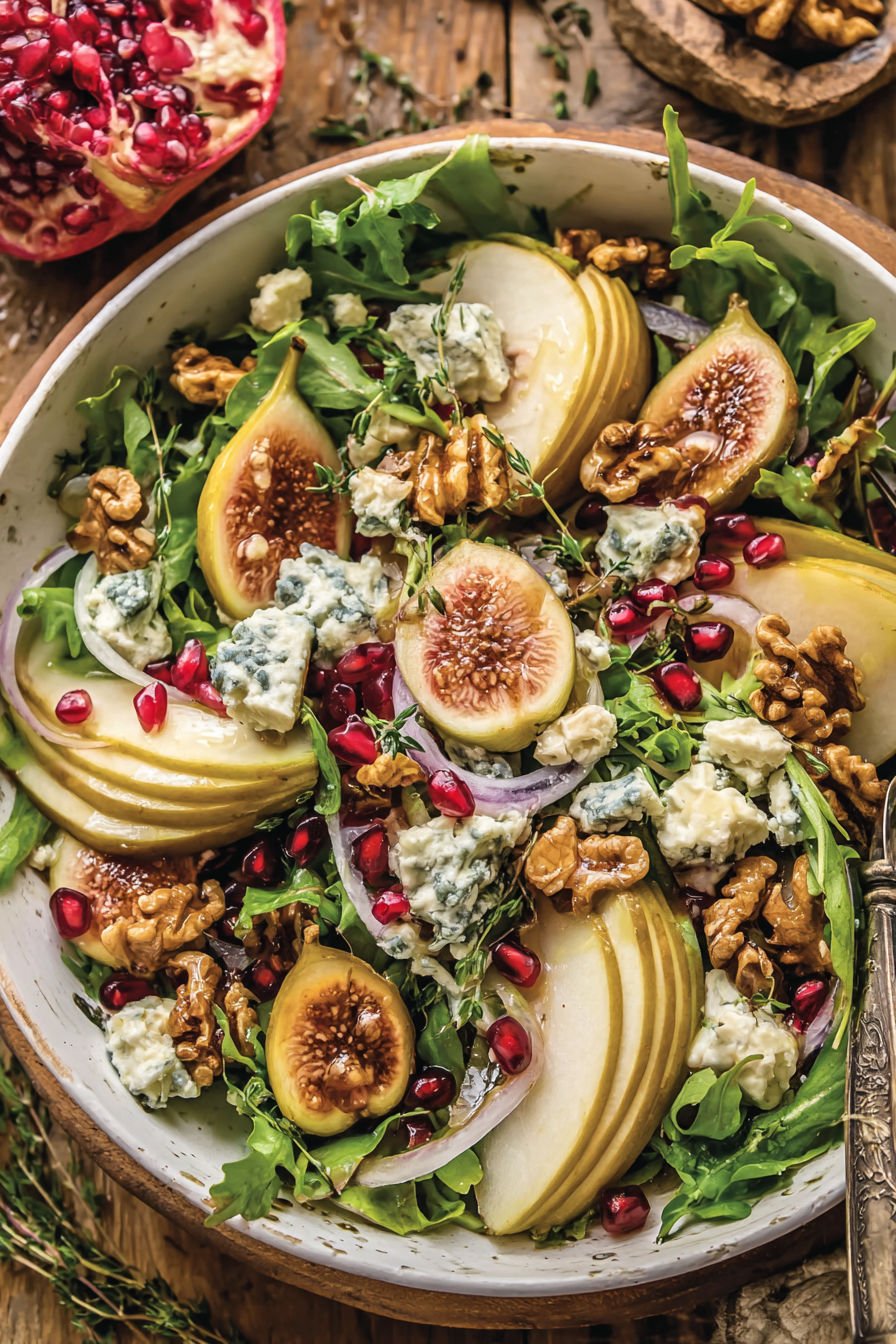 A salad with pear, walnut, and blue cheese.