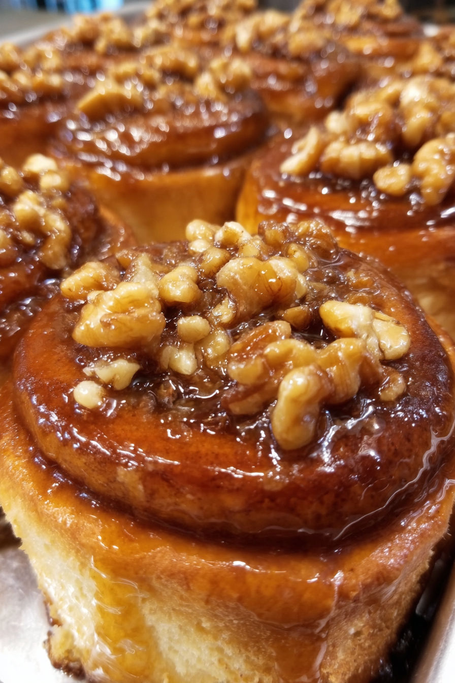 A close up of a cinnamon maple walnut sticky bun.