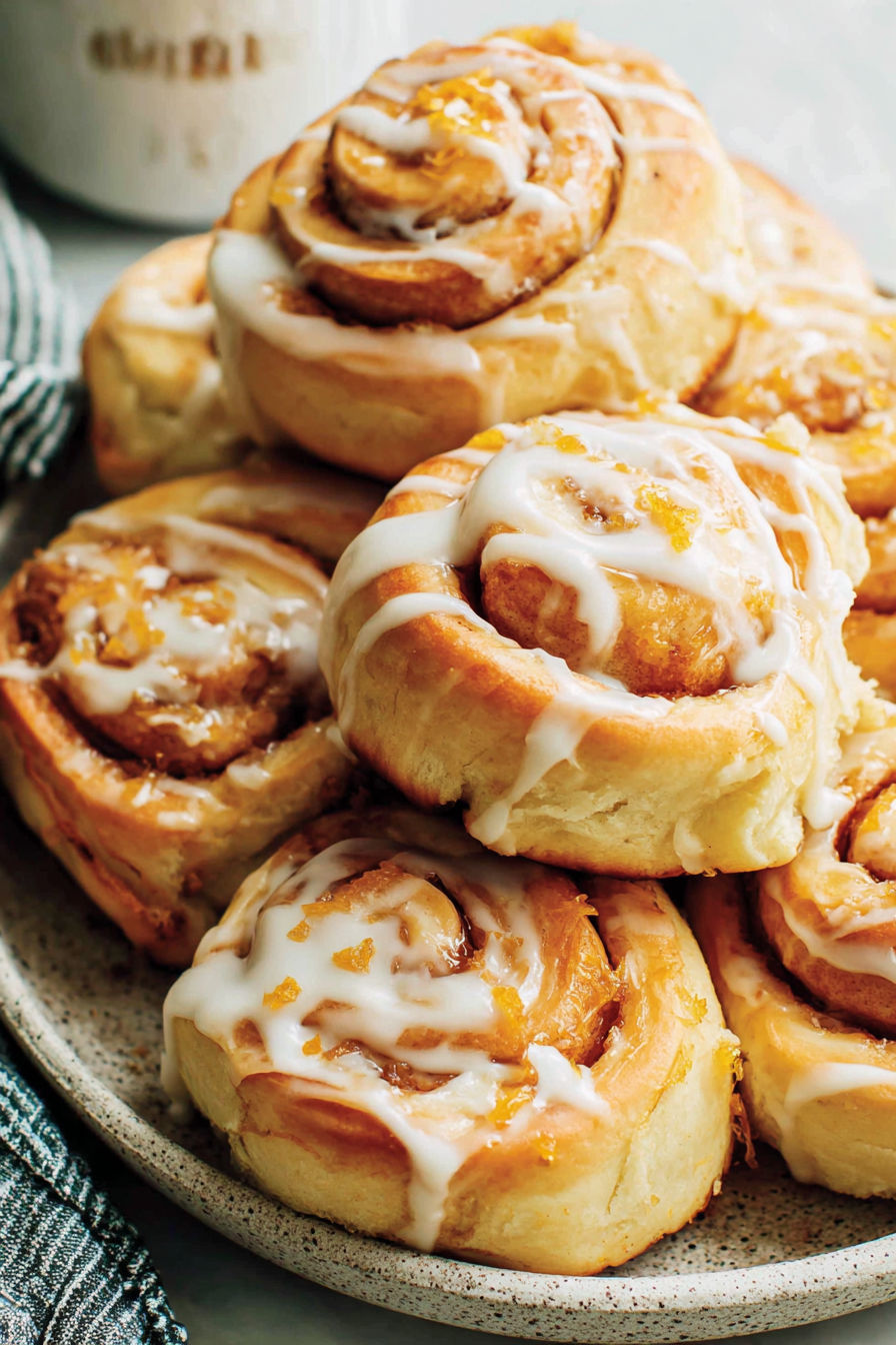 A plate of orange rolls.