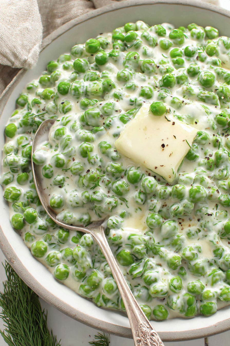 A bowl of food with a spoon in it.