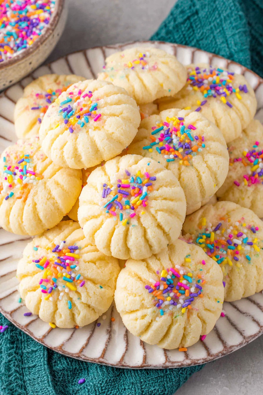 A plate of whipped shortbread cookies.