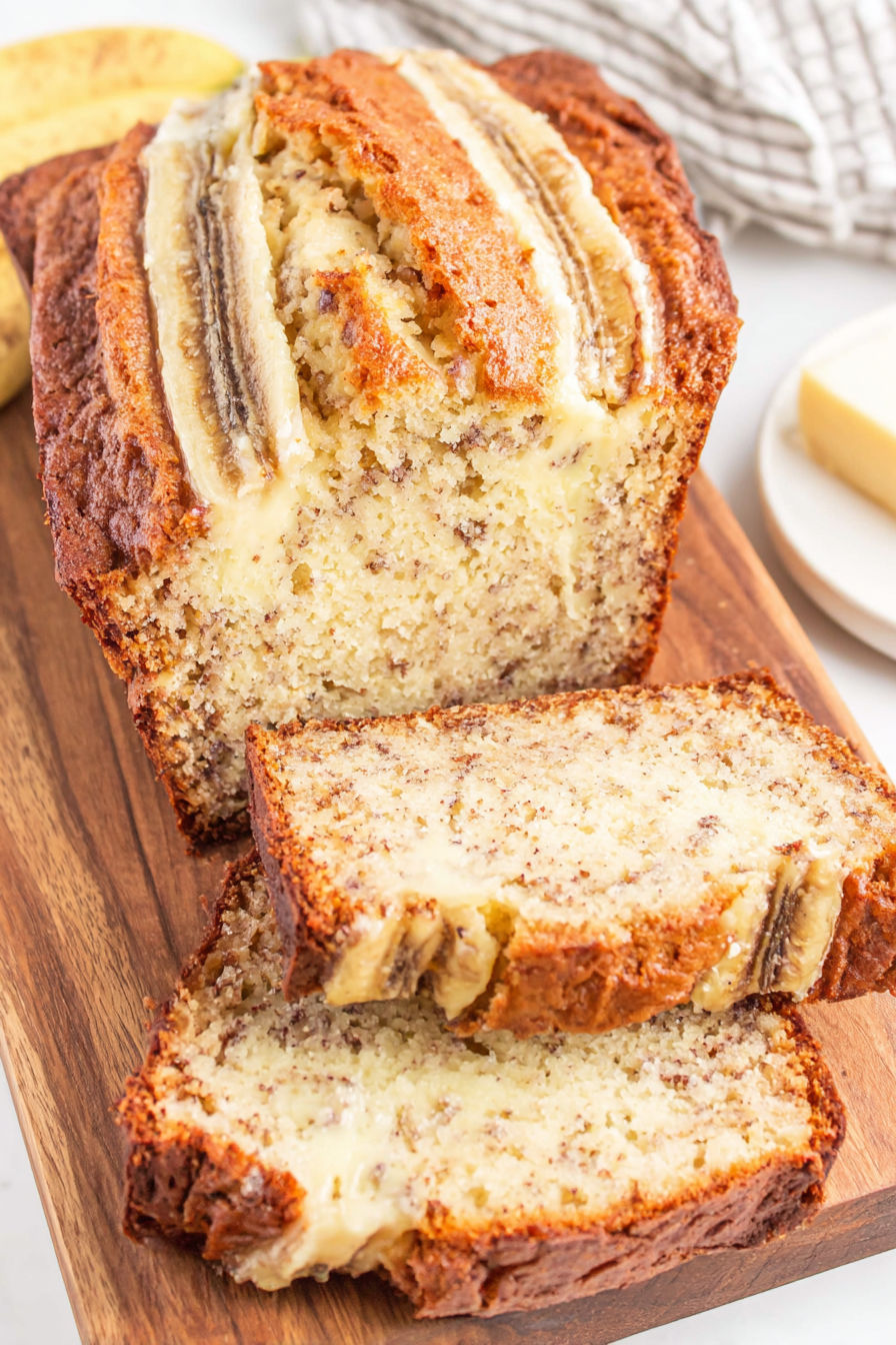 A slice of banana bread with cream cheese.