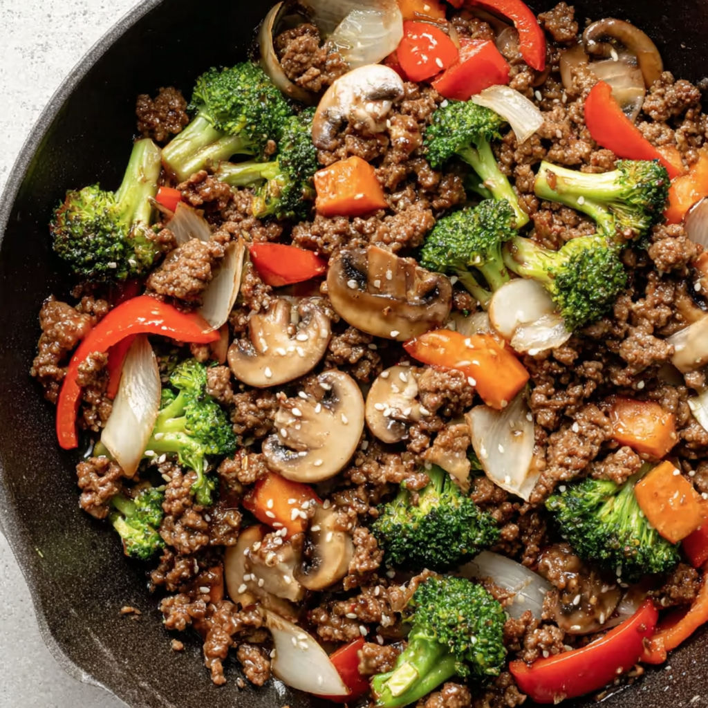 A stir fry with ground beef and various vegetables.