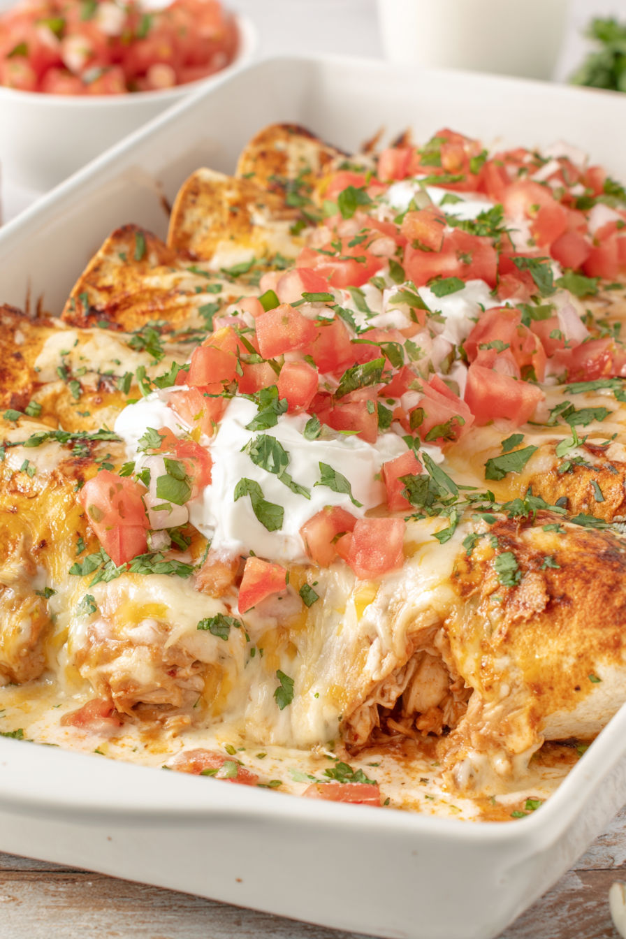 A plate of cream cheese chicken enchiladas.