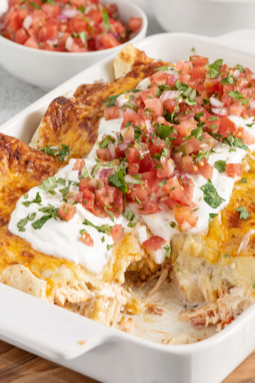 A dish of cream cheese chicken enchiladas.