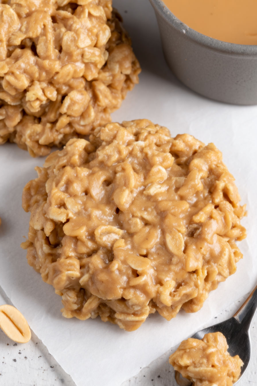 A close up of a cake with a spoon in it.