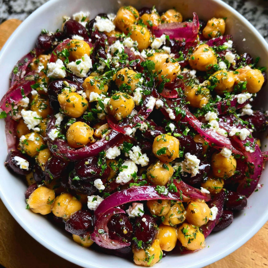 A bowl of chickpeas and black beans salad.