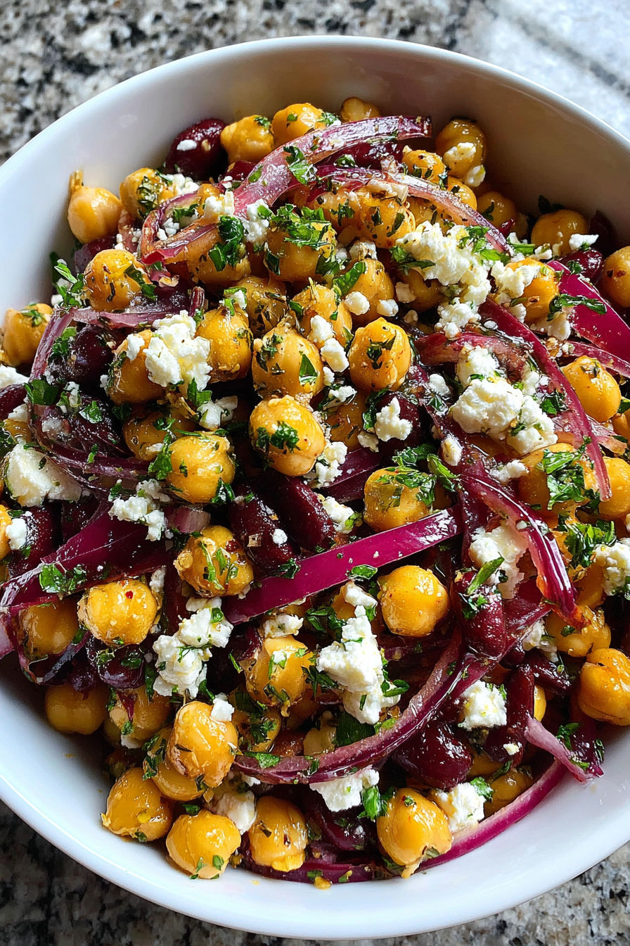 A bowl of chickpeas and black beans salad.