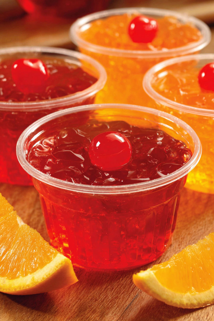 Four cups of Tequila Sunrise Jello Shots.