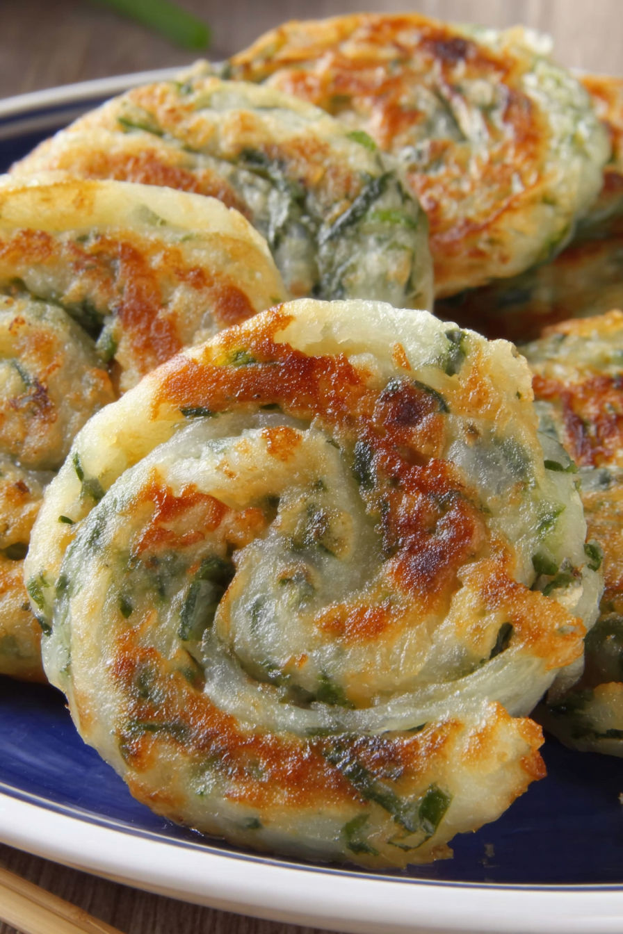 Rice paper scallion pancakes on a plate.
