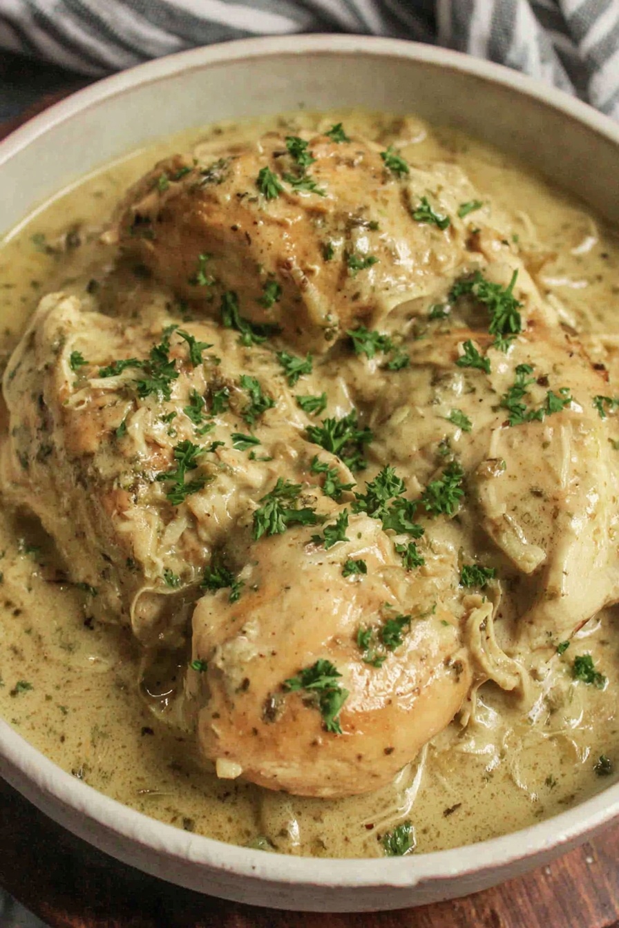 Chicken and gravy in a slow cooker.