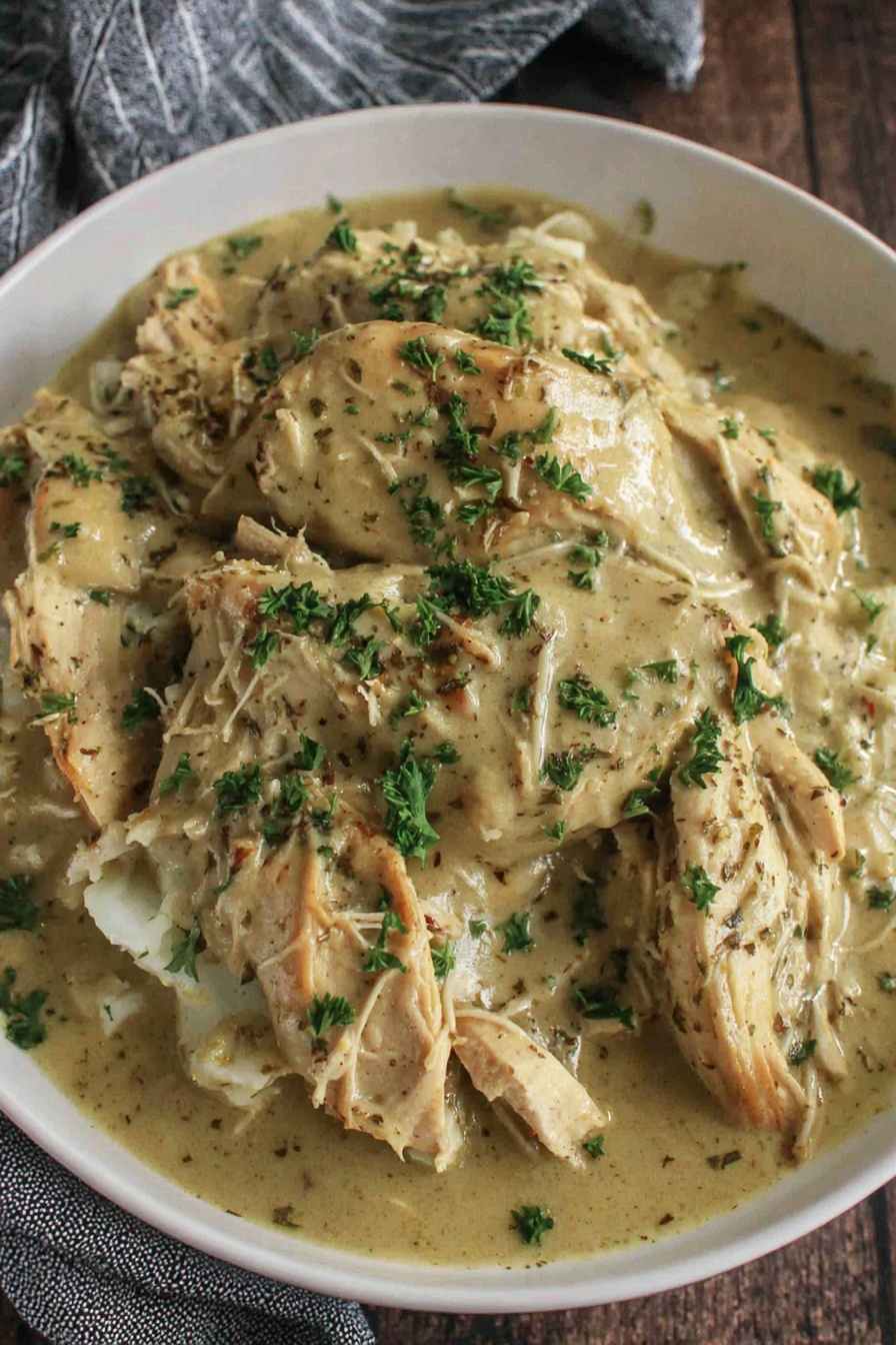 A plate of chicken and gravy.