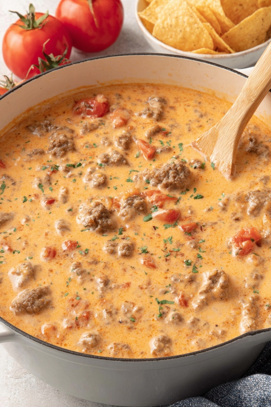 A bowl of meat and tomatoes.