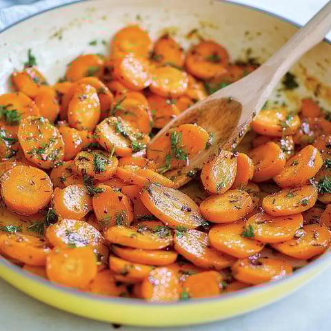 A bowl of garlic herb carrots.