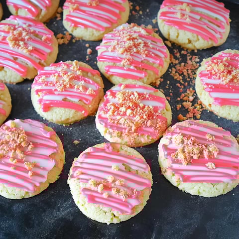 Pink and white cookies with pink frosting.