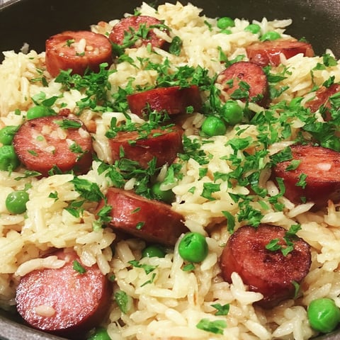 A skillet of rice and sausage.
