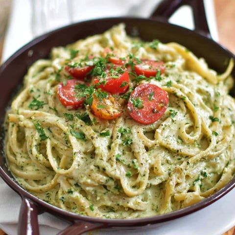 A bowl of creamy pesto pasta.