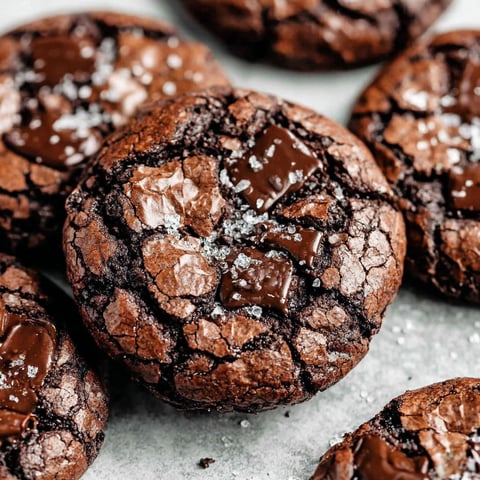 A close up of a chocolate brownie with chocolate drizzle.