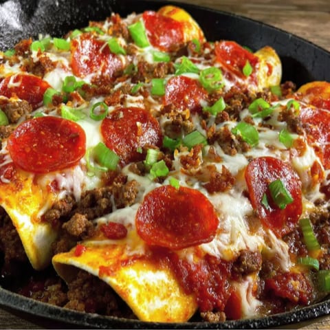 A delicious pizza enchilada with ground beef.