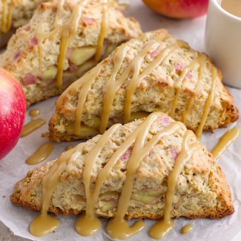 Two scones with maple glaze on a plate.