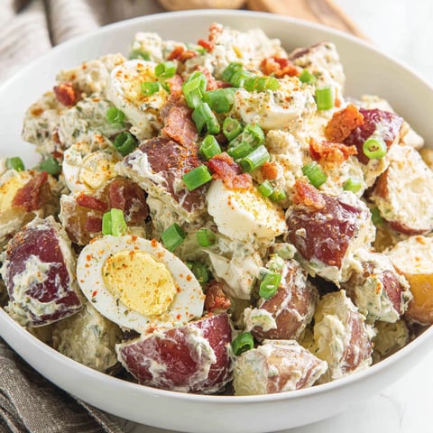 A bowl of roasted potato salad.