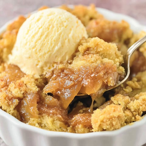 A white bowl filled with a dessert.