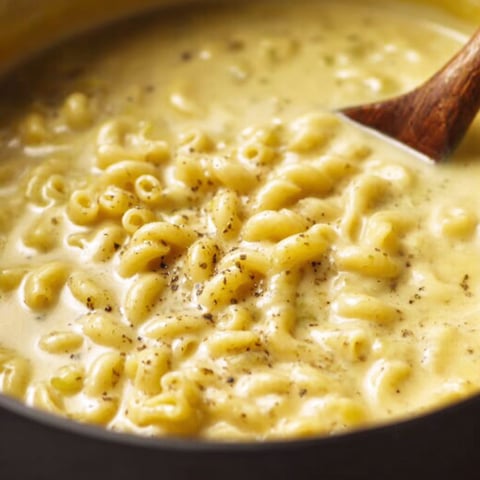 A bowl of mac and cheese soup.