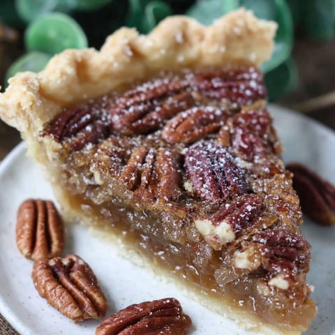 A slice of pecan pie on a plate.