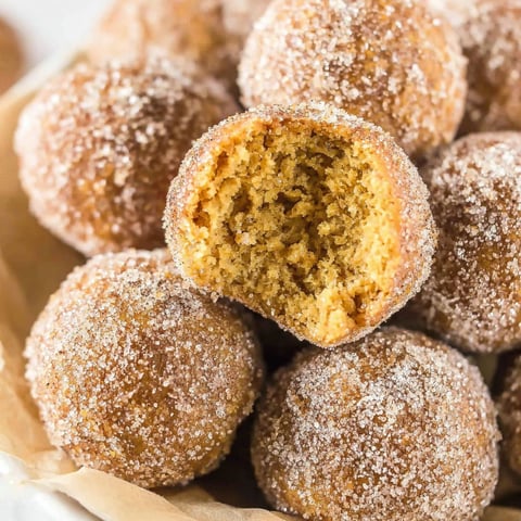 Pumpkin donut holes in a bowl.