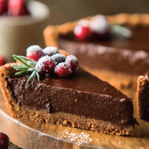 A slice of chocolate gingerbread tart.