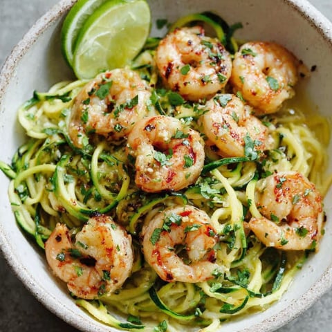 A bowl of shrimp and zucchini noodles.