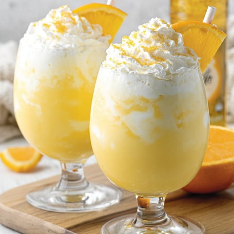 Two glasses of creamsicle drink.